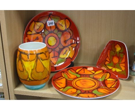 FOUR PIECES OF POOLE POTTERY, decorated with red/orange/green glazes, in abstract designs (4)