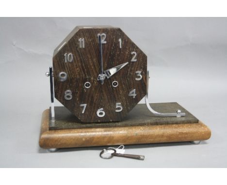 AN ART DECO STYLE OAK AND WALNUT CASED MANTEL CLOCK, with angular chrome supports, chromed Arabic numerals and hands, with ke