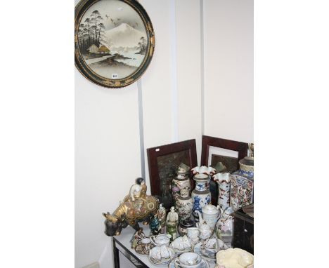 A GROUP OF ORIENTAL WARES, to include pictures, table lamp, eggshell teawares, Satsuma figure riding an Ox 'Made in Japan', o