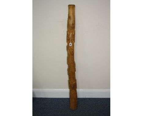 A MODERN DIDGERIDOO, with carving of a snake, approximate length 124cm