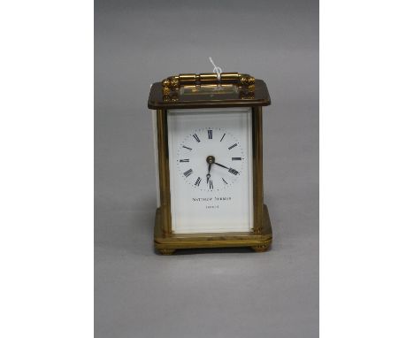 A MATTHEW NORMAN OF LONDON AND SWITZERLAND BRASS CASED CARRIAGE CLOCK, enamel dial, Roman numerals, serial No 1754, height 11
