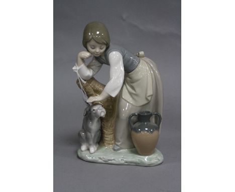 A BOXED LLADRO FIGURE OF A GIRL AND A DOG, 'Caress and Rest' No.1246, height approximately 20cm