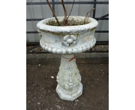 A PAINTED PRE-CAST GARDEN PLANTER, on baluster support