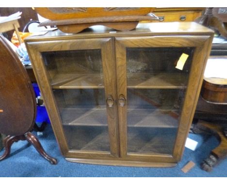 AN 'ERCOL' GLAZED TWO DOOR BOOKCASE, approximate size width 92cm x depth 29cm x height 97cm