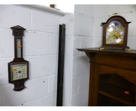 A BAROMETER, and a modern mantle clock, marked 'Hermle' (2)
