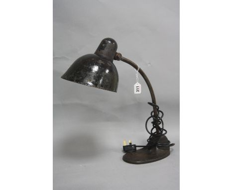 A BLACK PAINTED VINTAGE DESK LAMP, with adjustable shade and support cast base (please note item re-wired and tested as worki