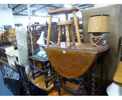 AN OAK BARLEY TWIST GATE LEG TABLE, two stools, four various lamps and a rug (8)