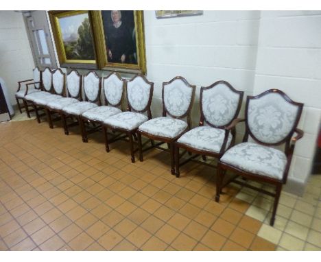 A SET OF TEN MAHOGANY DINING CHAIRS, including two carver chairs with light blue upholstery and drop in seat pads 