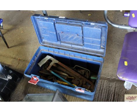 A plastic tool box with contents of various tools to include cold chisels and wrenches etc.