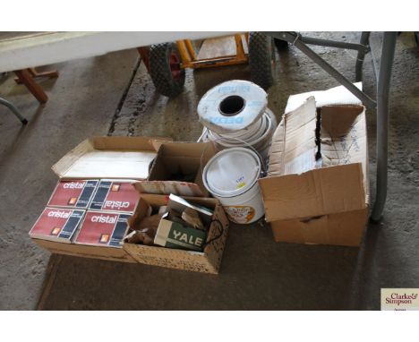 A box containing four boxes of Cristal ceramic floor tiles; various door furniture; electrical two core cabling; a tin of Myl