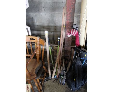 A quantity of long and short handled garden tools to include shears, garden edger's, hand saws etc.