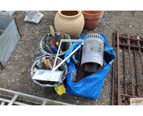 Two plastic builders buckets with contents of builders tools; a Webber BBQ ash pot; and a plastic bag of roofing tiles etc.