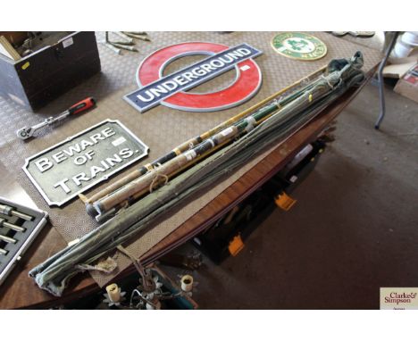 A quantity of various vintage fishing rods