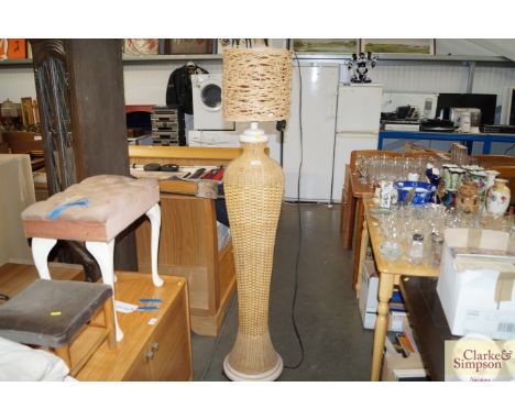 A modern standard lamp and shade