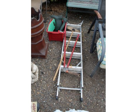 A plastic box containing Wellington boots size 6; a hand bulb planter; an aluminium folding step ladder; garden shears, broom