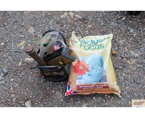 A bag of cactus and succulent Focus potting mix; and a small quantity of garden related tools 