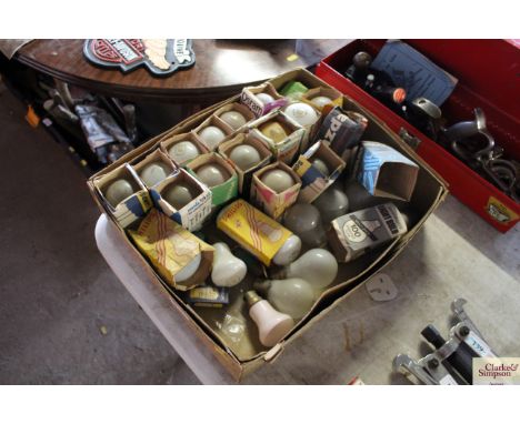 A box of various vintage light bulbs 