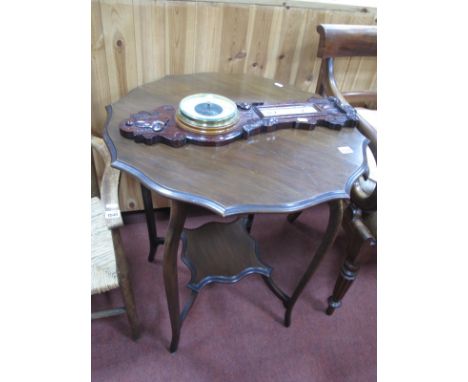 An Edwardian Window Table, having pie crust top and under shelf, united by sabre legs. Oak wall barometer. (2)