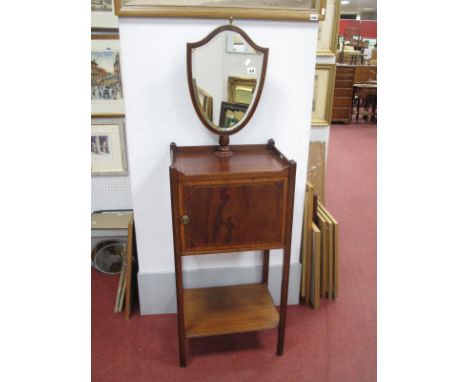 A XIX Century Mahogany Wash Stand, with shield mirror to galleried top, over single cupboard and lower shelf, 45.5cm wide.