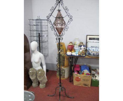 A Wrought Iron Standard Lamp, having amethyst glass shade, approximately 180cm high.