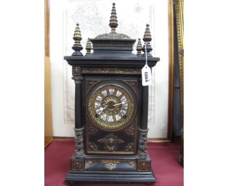 A Late XIX Century Continental Bracket Clock, of Gothic design, the ebonised case applied with cast metal mounts, the brass d