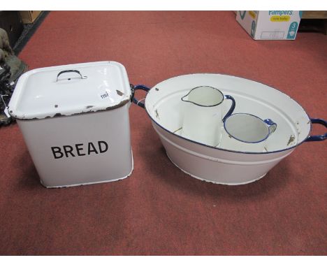 A Vintage Enamel Bread Bin, together with an enamel twin handled bowl, and two jugs. (4)
