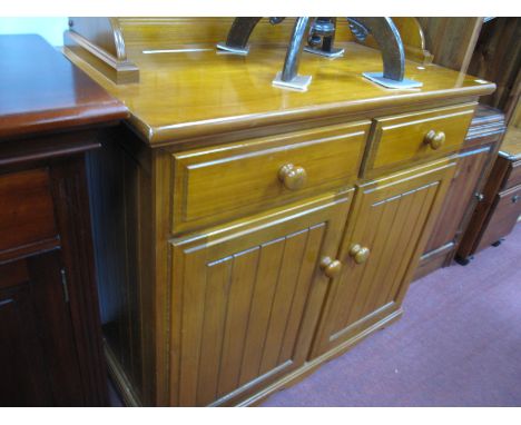 A Pine Effect Kitchen Cabinet, with an upper shelf, two drawers, over twin doors,on bracket feet.