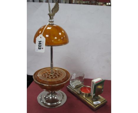 Art Deco Style Pull-Up Cigarette Dispenser, with eagle surmount on smokey amber coloured globe and chromed base' a smokers de