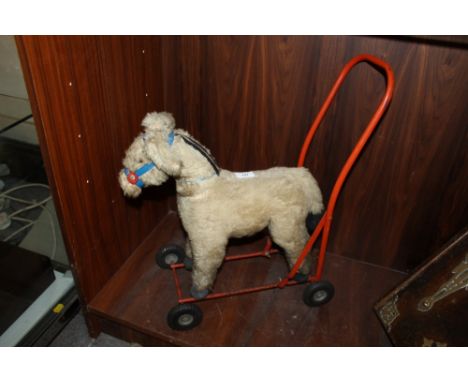 A VINTAGE CHILDS SIT ON HORSE, MADE IN IRELAND BY LINE BROS (IRELAND) LTD