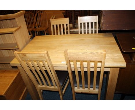 A MODERN LIGHT OAK DINING TABLE + FOUR CHAIRS
