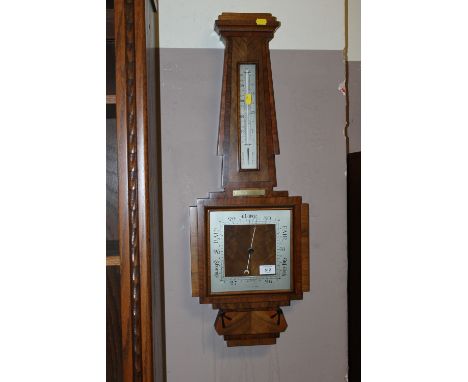 AN ART DECO STYLE BAROMETER WITH INALID DETAIL