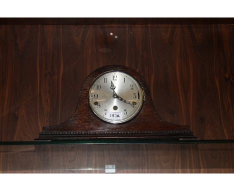 AN OAK MANTLE CLOCK