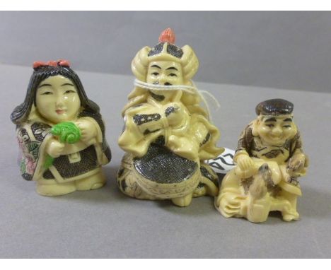 Three Netsuke style carvings including girl with gift, drummer and a man with rats