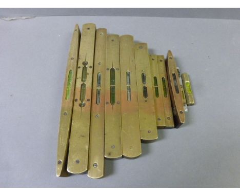 Eleven vintage spirit levels, mainly brass and wooden variety