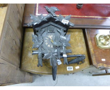 A Swiss cuckoo clock in a pine case 