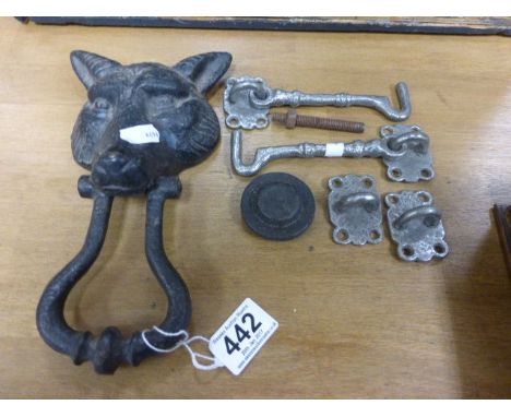 A door knocker in the form of a fox mask