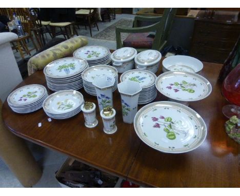 A large ceramic dinner service each piece decorated various flowers  