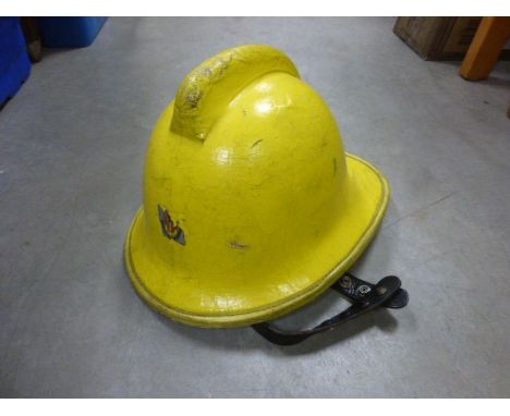 A vintage Gloucestershire fire helmet 