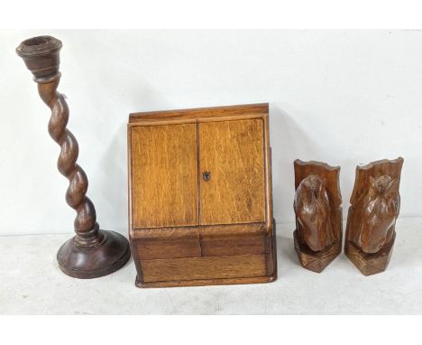 A late 19th/20th century oak stationery cabinet, together with an oak spiral candle stick along with a pair of 20th century h