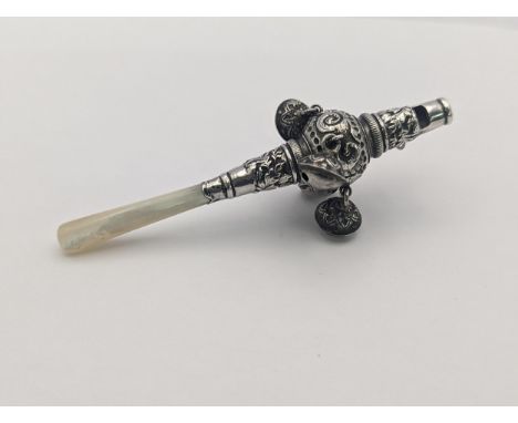 A late 19th/early 20th century white metal baby rattle whistle having a Mother of Pearl handleLocation 