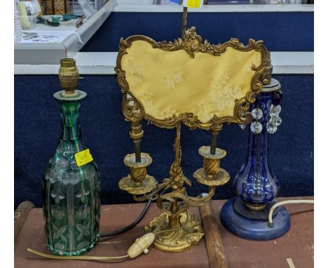 A French 19th century Ormalu bouillotte lamp, a Bohemian glass decanter converted to lamps and a blue glass lampLocation: BWR