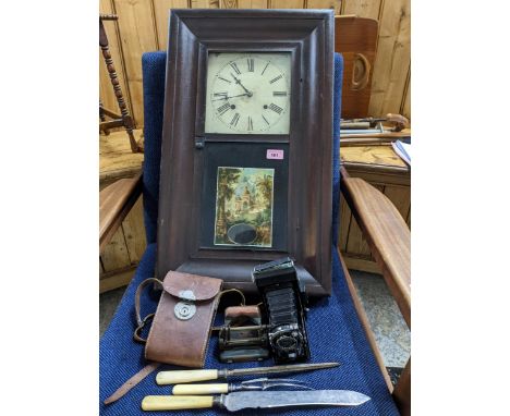 A late 19th/early 20th American Waterbury Clock co wall clock, painted white enamel roman dial, the case with glazed picture 