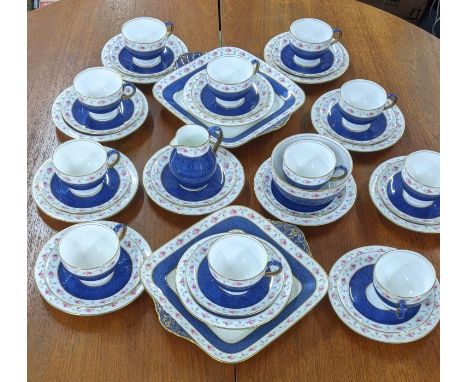 A Wedgwood part tea service with a blue ground decorated with flowers and a gold coloured bandLocation: 