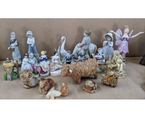 A mixed lot of models and figurines to include two CWS Scottish studio pottery models of Highland Cows, a Nao figure and othe