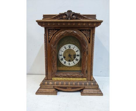 An early 20th century walnut cased mantel clock with a Junghams gong striking movementLocation: G 