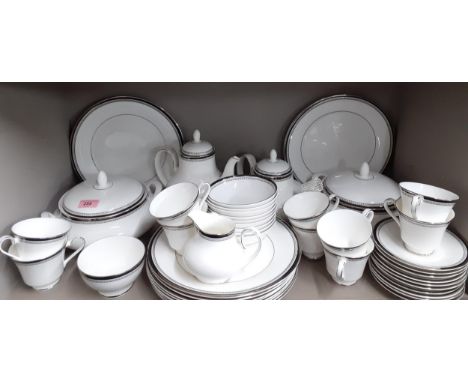 A Royal Doulton 'Sarabande' part dinner and tea service having a white ground with silver coloured band to the edge to includ