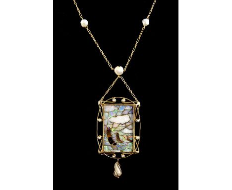  A fine Arts &amp; Crafts period  pendant in the manner of Archibald Knox, with a plaque of opal mosaic  depicting  three sai