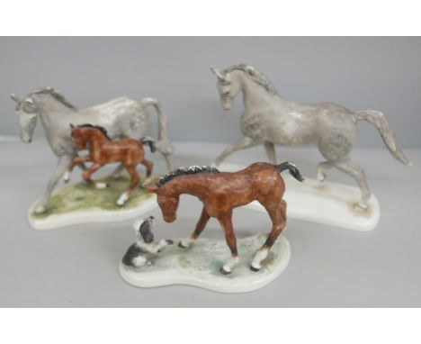 A set of three Goebel horse figures, one with a dog
