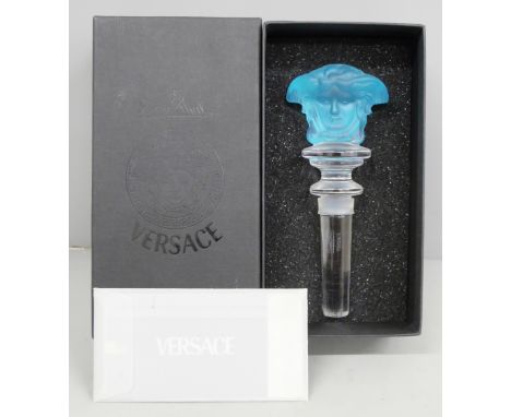A Versace light blue glass bottle stopper, boxed