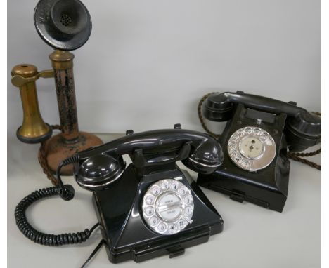 Three telephones comprising an early 20th Century candlestick phone, a 1940s Bakelite phone and a modern reproduction